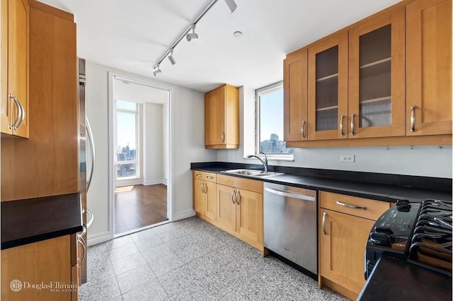 401 E 60th St Unit 38Ab, New York City, NY 10065 - kitchen featuring stainless steel dishwasher, dark countertops, and glass insert cabinets