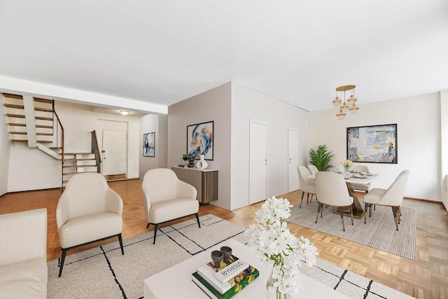 living room featuring an inviting chandelier and light parquet flooring