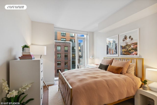 bedroom featuring a wall of windows and visible vents