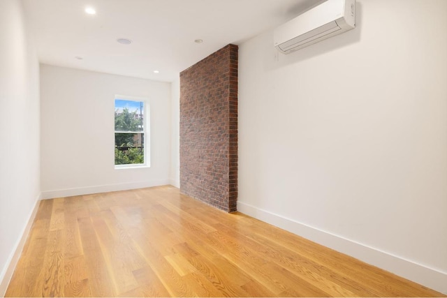 clothes washing area with stacked washer and clothes dryer and light hardwood / wood-style floors