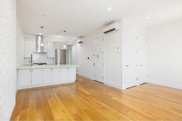 spare room with light hardwood / wood-style flooring