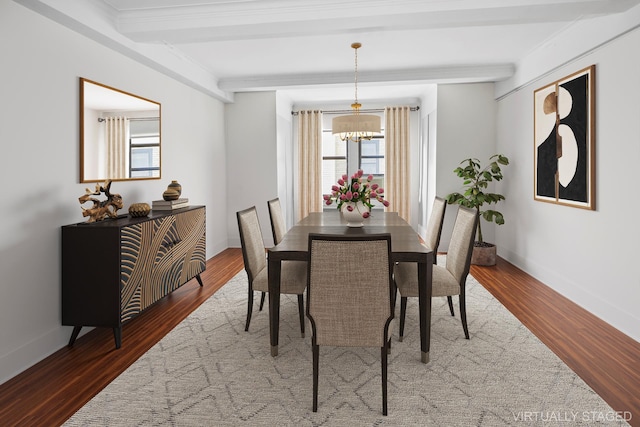 dining area with a chandelier, beamed ceiling, wood finished floors, and baseboards