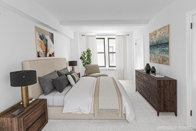 bedroom with beamed ceiling and light carpet