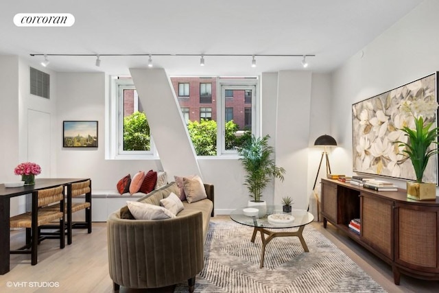 sitting room featuring light hardwood / wood-style flooring