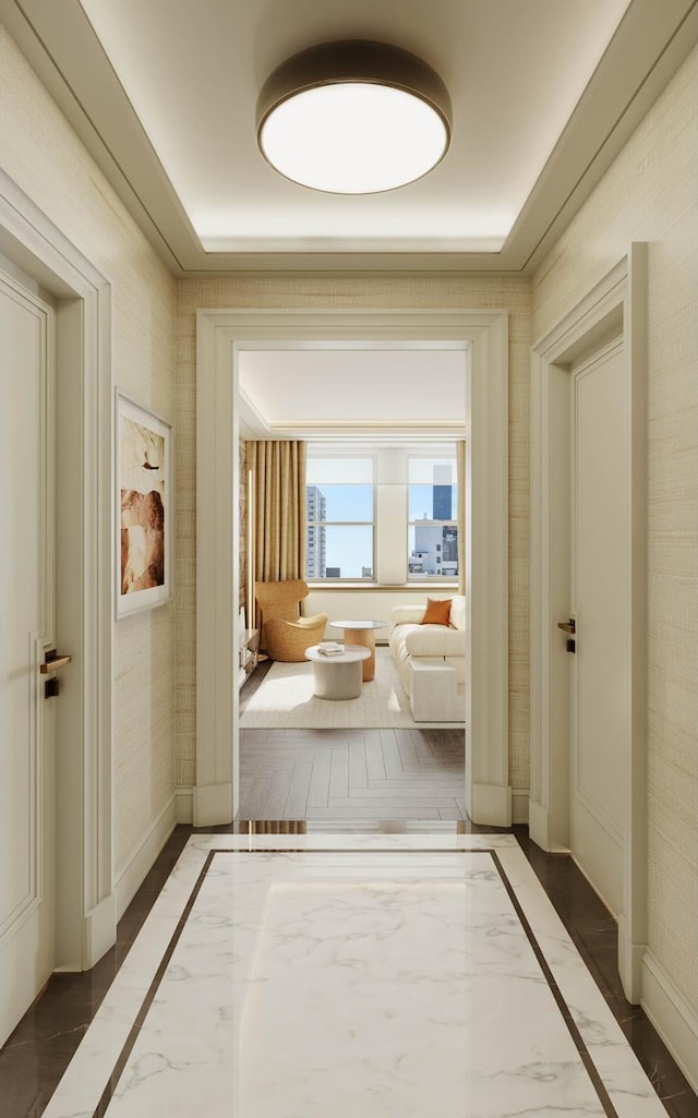 interior space featuring baseboards and marble finish floor