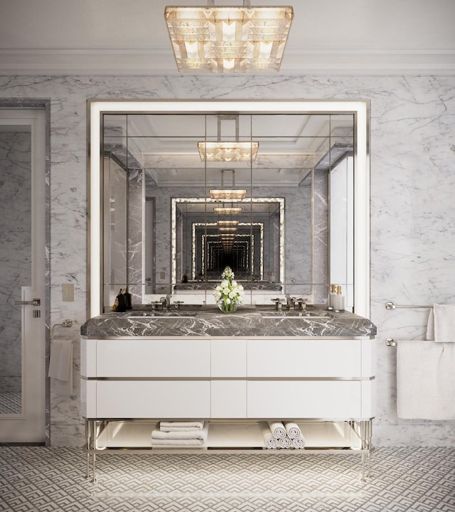 bathroom featuring a sink, ornamental molding, and double vanity