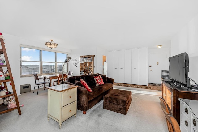 living room featuring light carpet