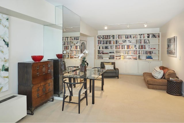 sitting room with light colored carpet and radiator