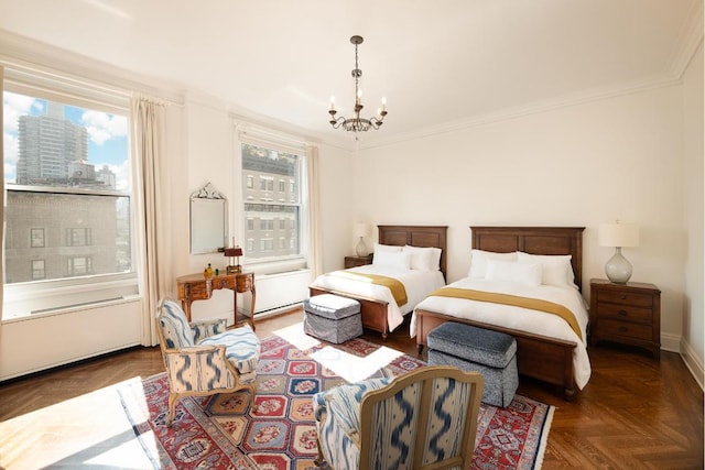 bedroom featuring dark parquet flooring, an inviting chandelier, and crown molding