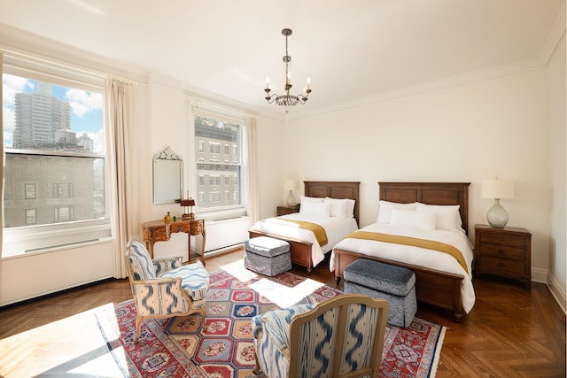 bedroom with crown molding, a view of city, a chandelier, and multiple windows