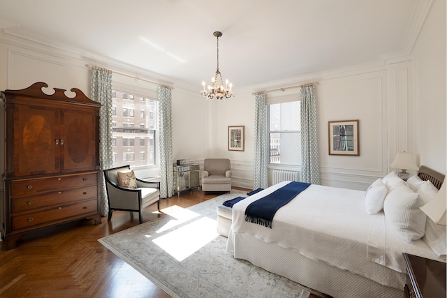 bedroom featuring ornamental molding, radiator, a chandelier, and multiple windows