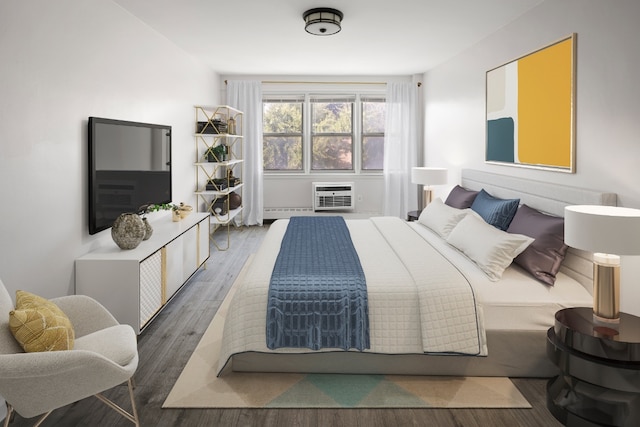 bedroom featuring an AC wall unit and dark hardwood / wood-style floors