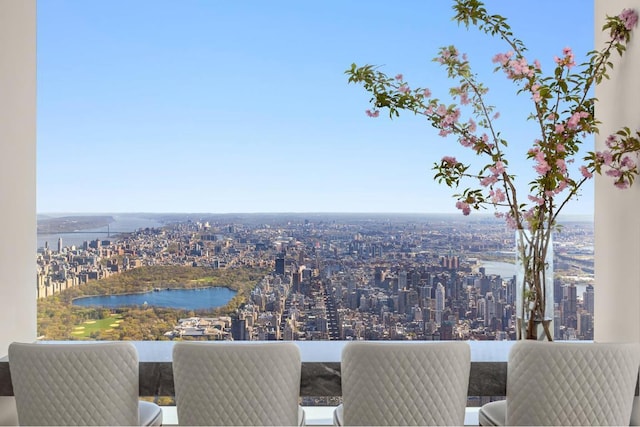 balcony featuring a view of city and a water view