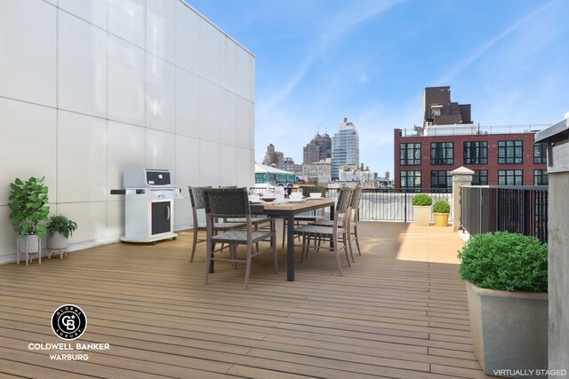 139 Bowery Unit 8C, New York City, NY 10002 - wooden terrace featuring a view of city and outdoor dining space