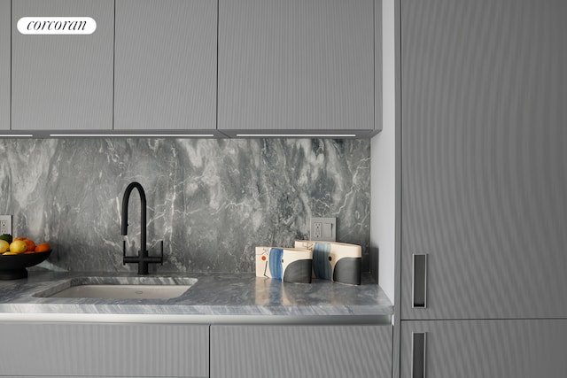 detailed view of tasteful backsplash and a sink