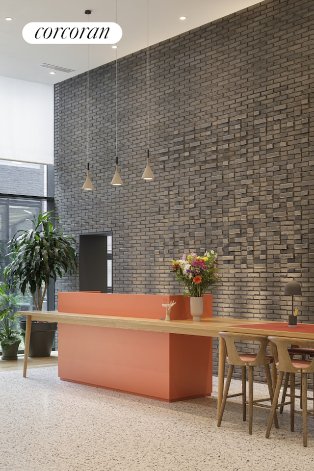 welcome area featuring recessed lighting and a high ceiling