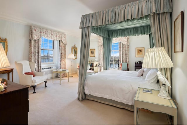 carpeted bedroom featuring multiple windows and ornamental molding