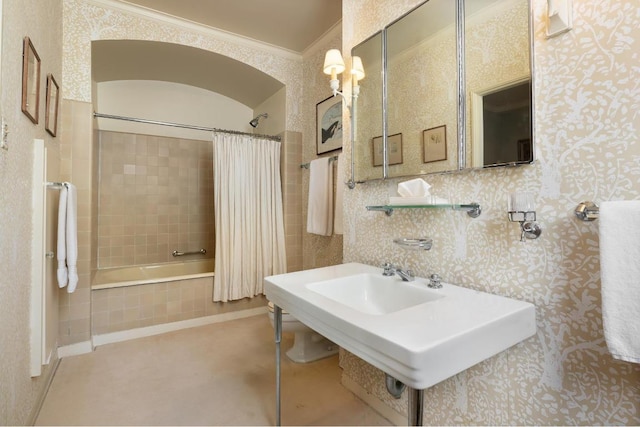 bathroom featuring ornamental molding and shower / bathtub combination with curtain