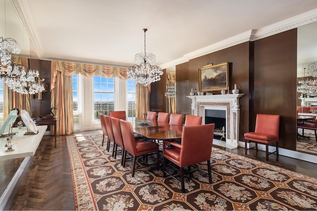dining space with a fireplace with flush hearth, an inviting chandelier, and crown molding