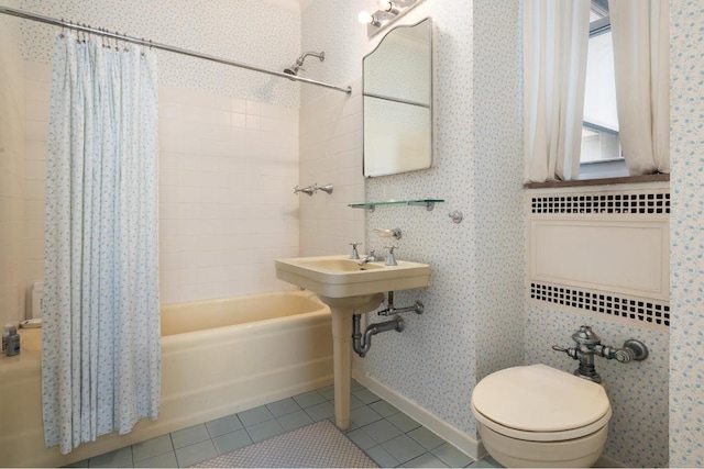 bathroom featuring toilet, tile patterned flooring, and shower / tub combo with curtain