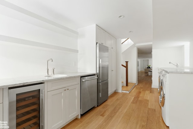10 Polhemus Place, New York City, NY 11215 - dining area featuring a chandelier and light hardwood / wood-style floors