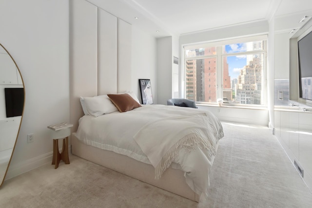 515 Park Ave Unit 19Fl, New York City, NY 10022 - carpeted bedroom with visible vents, a city view, and baseboards