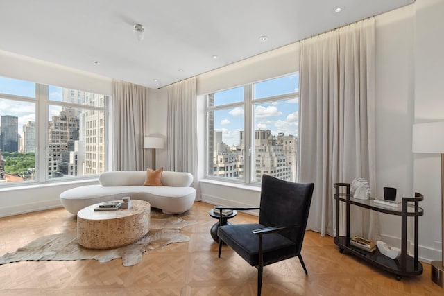 515 Park Ave Unit 19Fl, New York City, NY 10022 - living area with a view of city, recessed lighting, and baseboards