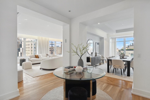 515 Park Ave Unit 19Fl, New York City, NY 10022 - living room with a healthy amount of sunlight, recessed lighting, light wood-style flooring, and baseboards