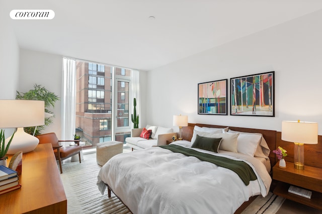 bedroom with a wall of windows and visible vents