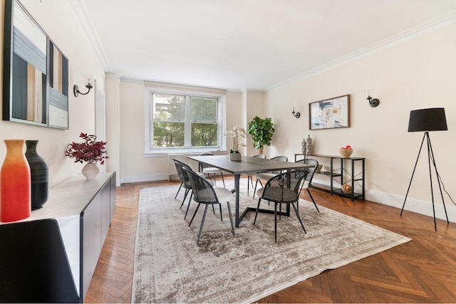 dining space with parquet flooring and crown molding