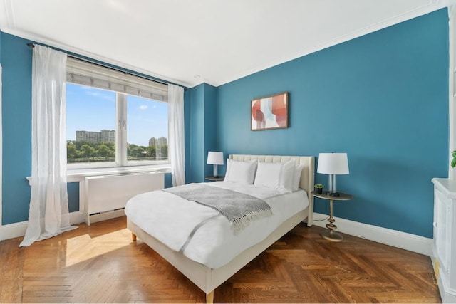 bedroom featuring ornamental molding and dark parquet floors