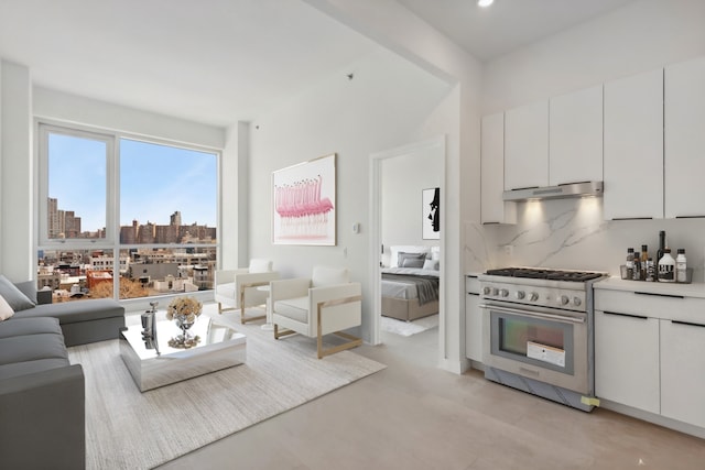 139 Bowery Unit 12B, New York City, NY 10002 - living area featuring light wood-type flooring and recessed lighting