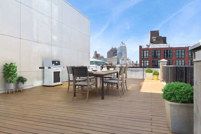 139 Bowery Unit 12B, New York City, NY 10002 - wooden terrace featuring outdoor dining area and a view of skyline