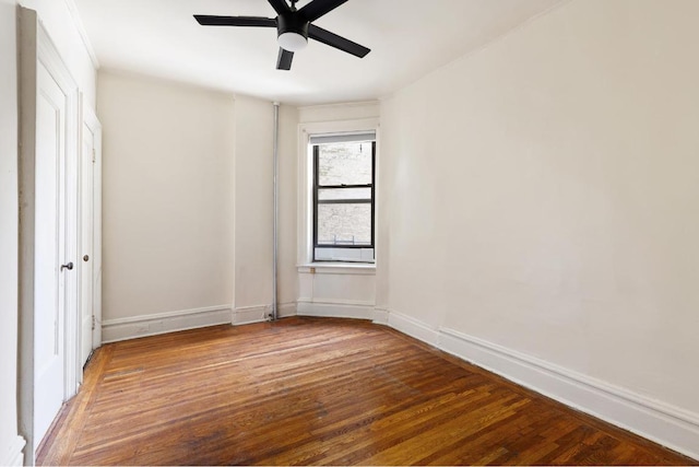 unfurnished room with wood-type flooring and ceiling fan