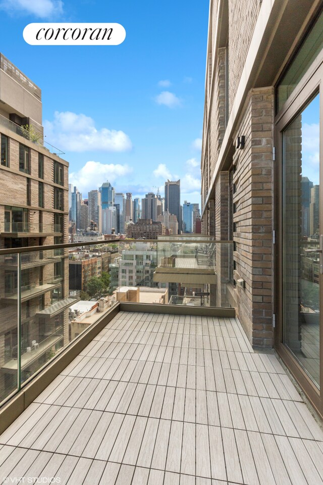 505 W 43rd St Unit 12H, New York City, NY 10036 - wooden deck with a skyline view