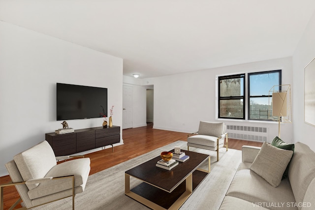 living room featuring radiator heating unit and wood finished floors