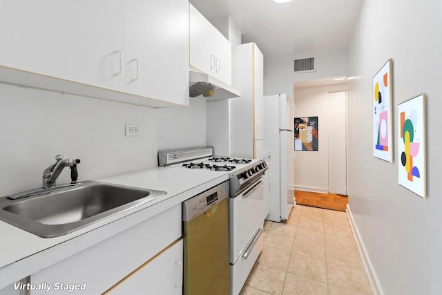 233 E 70th St Unit 10T, New York City, NY 10021 - kitchen featuring white appliances, under cabinet range hood, white cabinetry, and light countertops