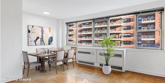 dining area featuring baseboards