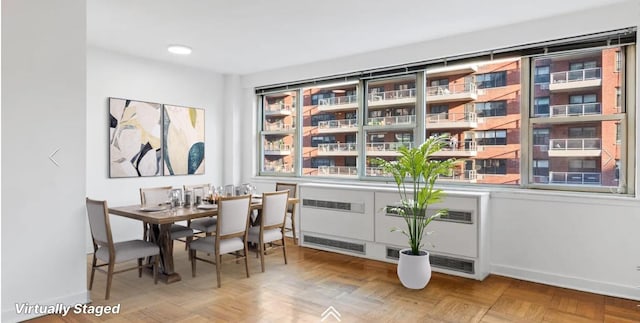 233 E 70th St Unit 10T, New York City, NY 10021 - dining room featuring baseboards