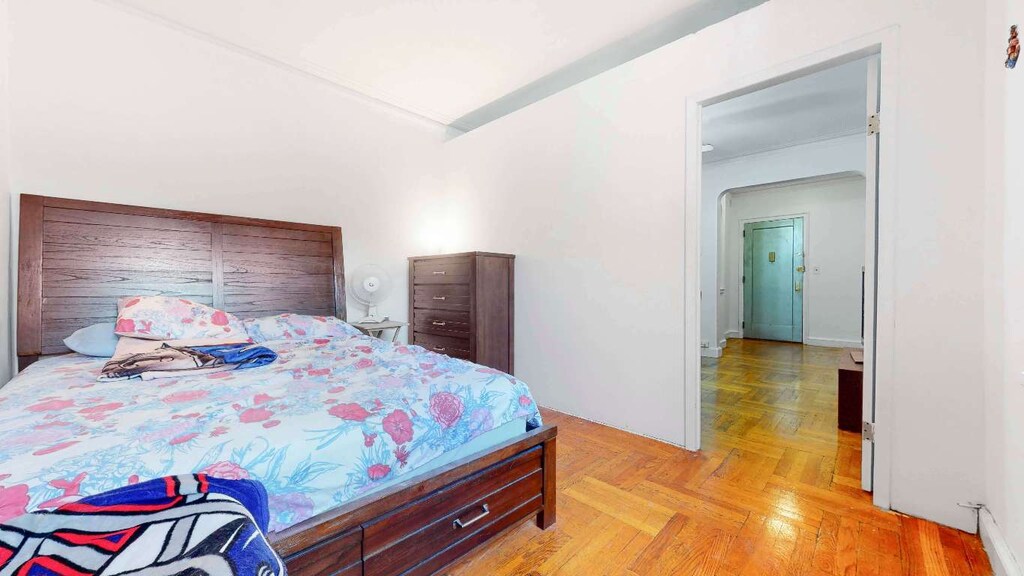 bedroom featuring light parquet floors