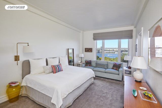 bedroom featuring a water view and visible vents