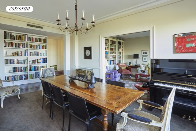 dining space featuring ornamental molding, wood finished floors, and visible vents