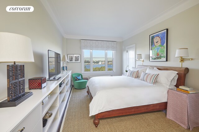 carpeted bedroom featuring visible vents and ornamental molding