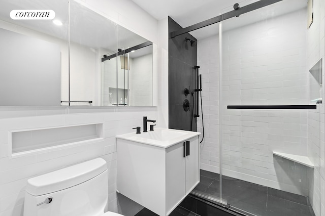 bathroom featuring visible vents, toilet, a stall shower, and vanity