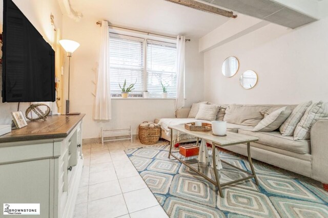 dining space with tile patterned floors