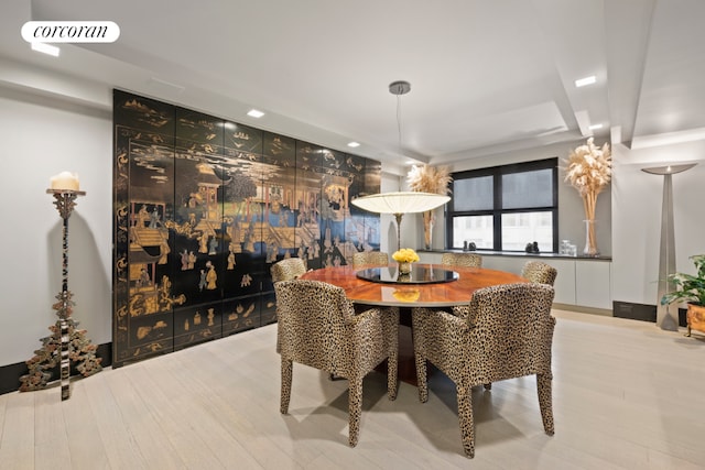 dining space with light hardwood / wood-style floors