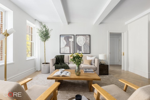 living room with beam ceiling and baseboards