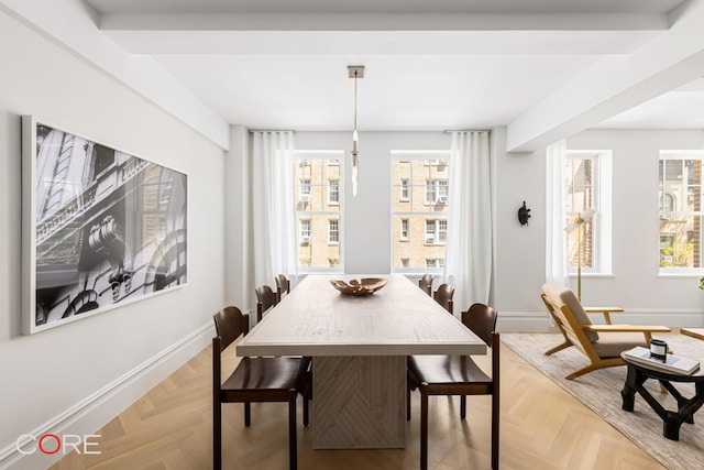 dining space with plenty of natural light and baseboards