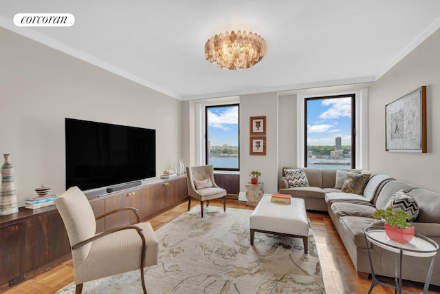 living room featuring light wood-type flooring, ornamental molding, and a wall of windows