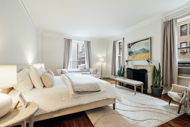 bedroom featuring crown molding and dark wood-type flooring